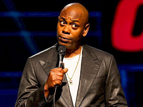 LGBTQ+ Advocates Demand Netflix To Remove Dave Chappelle's New Stand-Up Special